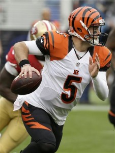 Cincinnati Bengals quarterback AJ McCarron (5) rolls out to pass against the San Francisco 49ers during the first half of an NFL football game in Santa Clara, Calif., Sunday, Dec. 20, 2015. (AP Photo/Eric Risberg)